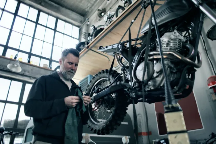 man changing oil